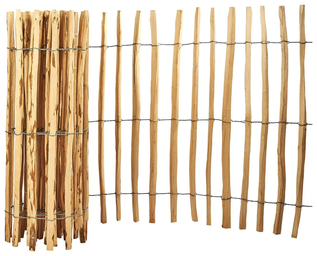 A fence roll standing at one end and unrolled across the rest, the split pickets bound on three rows of galvanised wire.